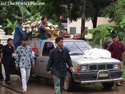 Carrying coffin to the Buddhist temple