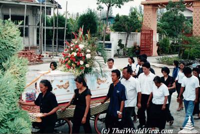 Carrying coffin to the Buddhist temple