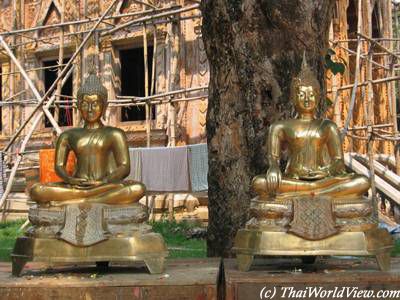 Cleaning Buddha statues