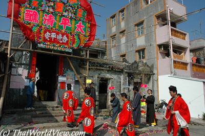 Taoist priests visiting village